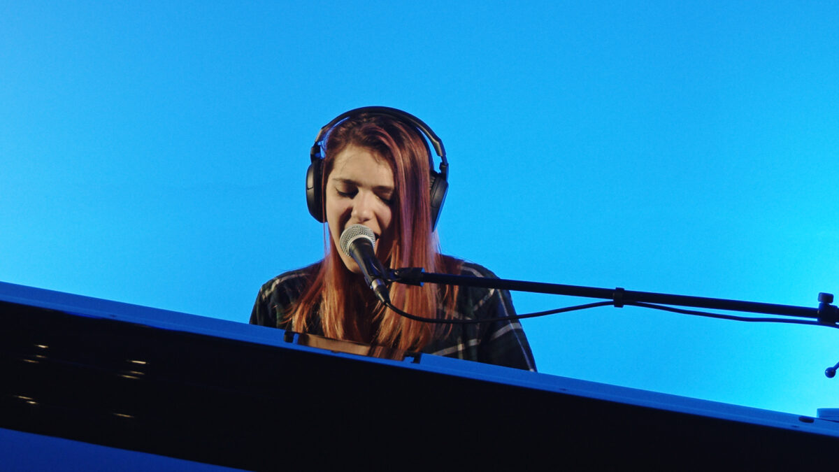 Singer Songwriter Jena Rhys sings her original song entitled Rescue